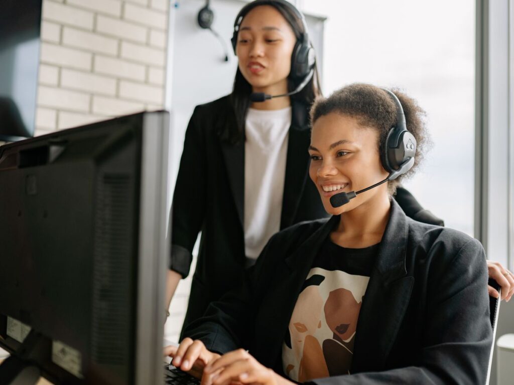 Service coordinators with headsets scheduling HVAC appointments