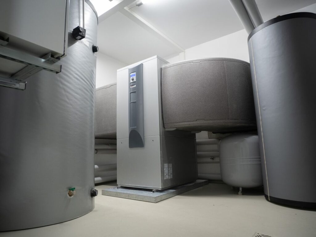 Indoor heat pump system installed in a utility room